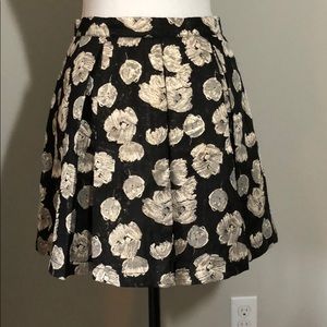 Floral metallic exposed zipper flare skirt.